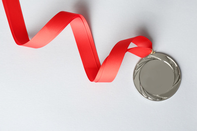 Silver medal on white background, top view. Space for design