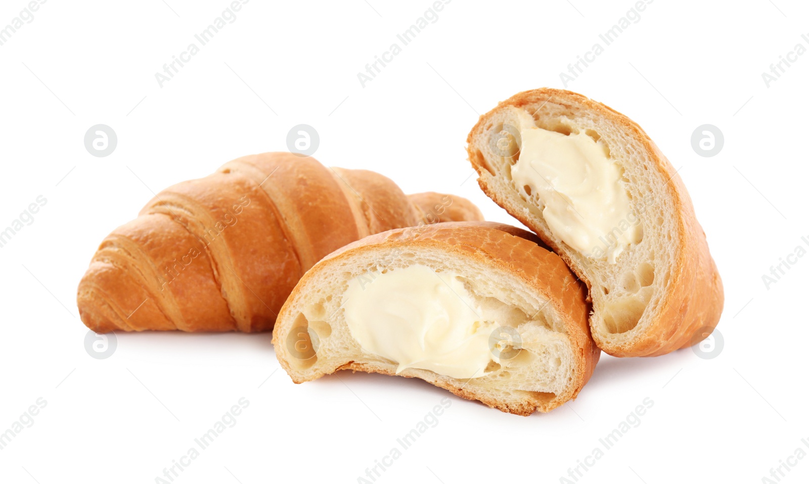 Photo of Delicious croissants with cream on white background