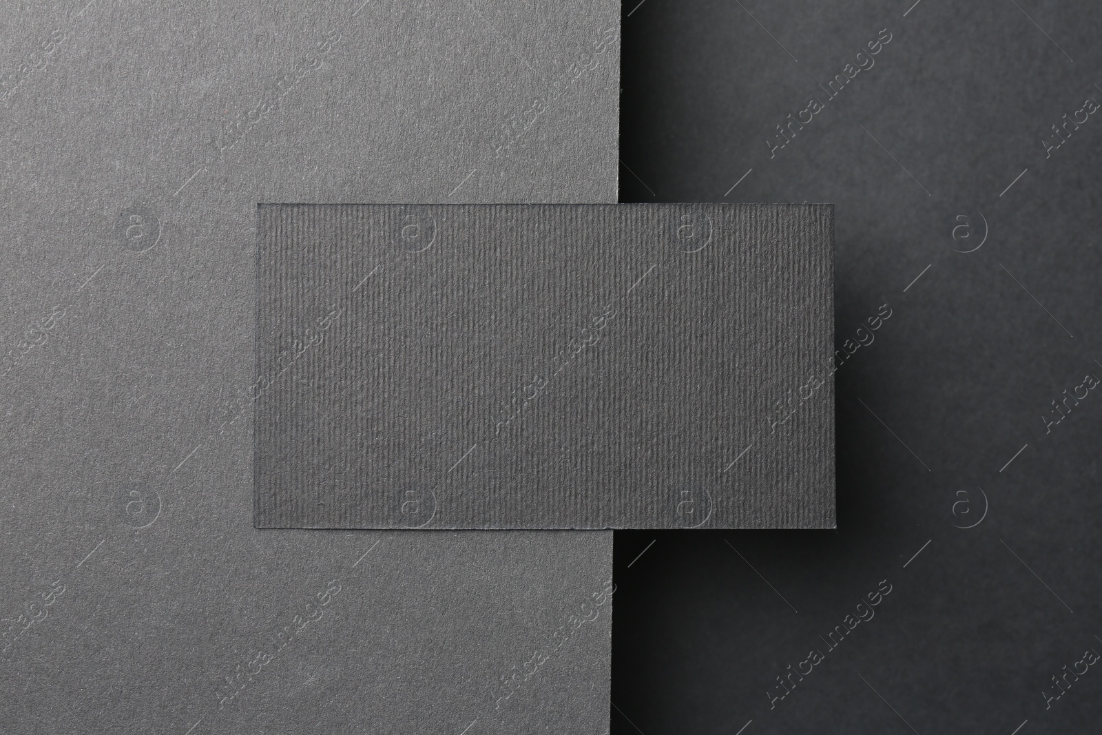 Photo of Blank business card on black background, top view. Mockup for design