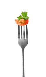 Photo of Fork with tasty tomato and parsley isolated on white