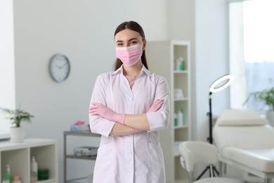 Cosmetologist in medical uniform in modern clinic