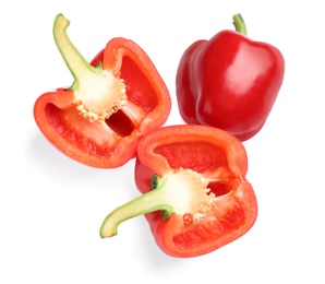 Photo of Cut and whole ripe red bell peppers on white background, top view