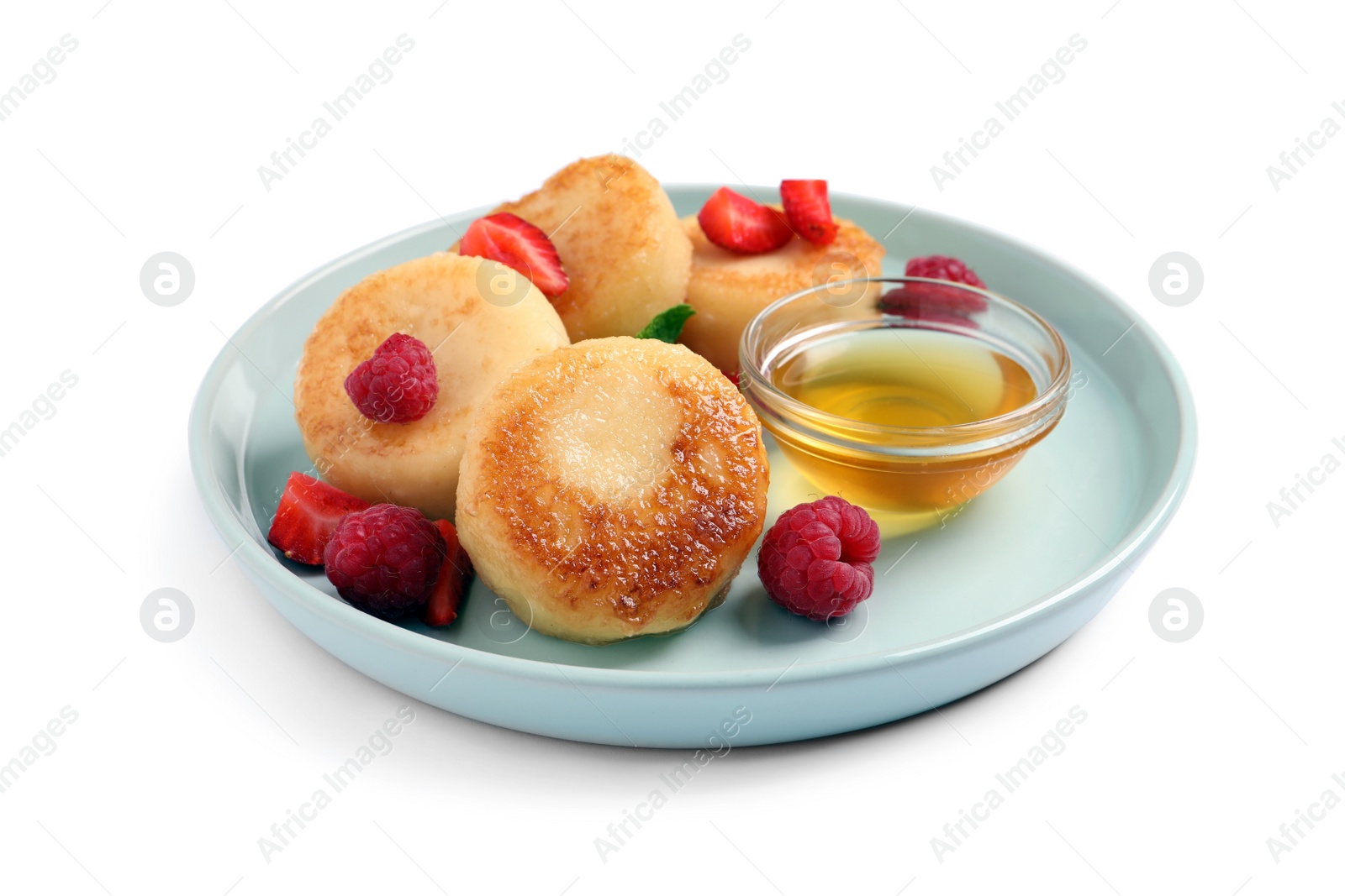Photo of Delicious cottage cheese pancakes with fresh berries and honey on white background