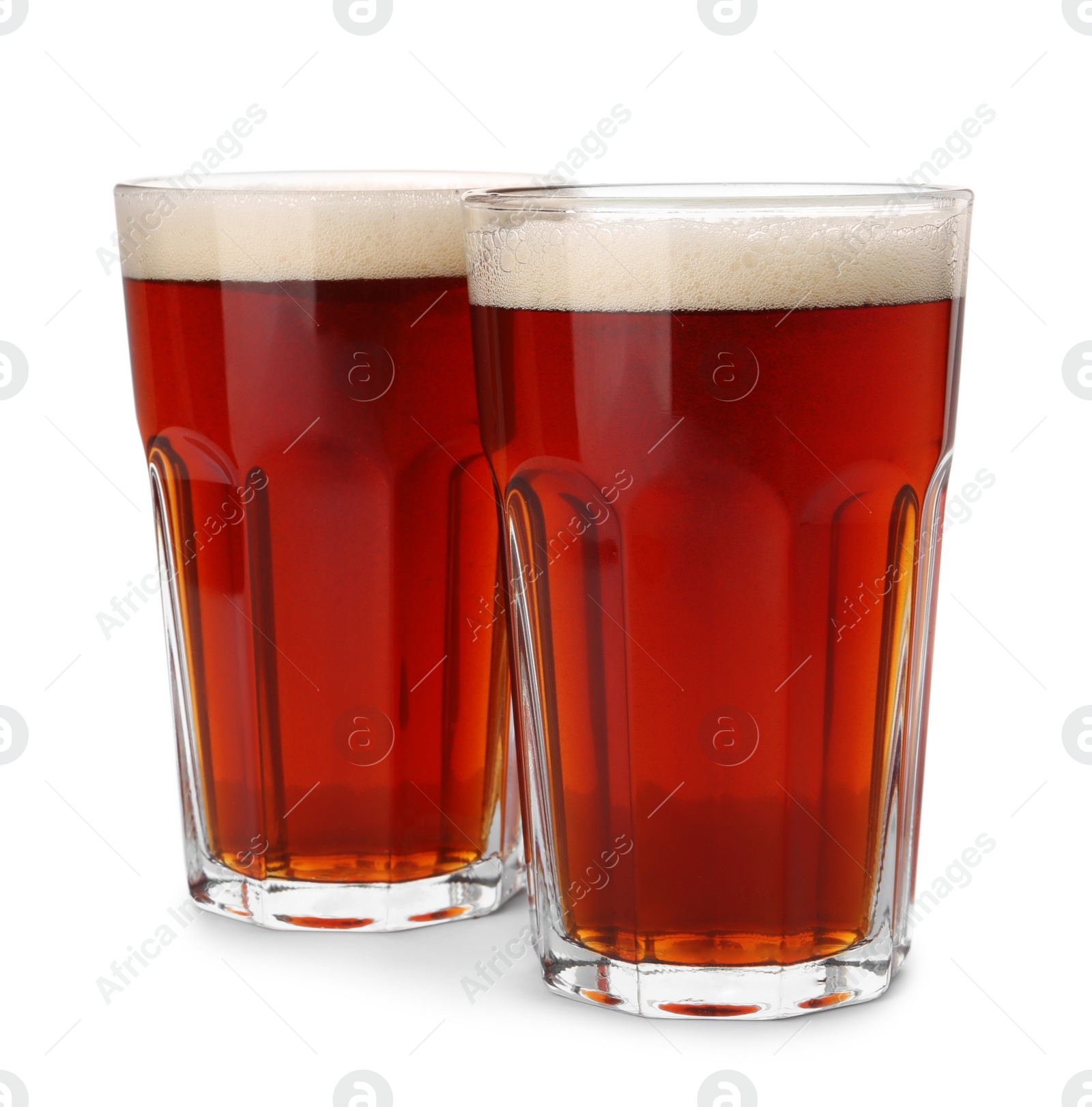 Photo of Glasses of delicious kvass on white background