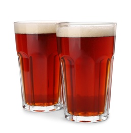 Photo of Glasses of delicious kvass on white background