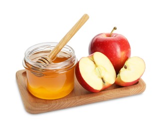 Photo of Delicious apples, jar of honey and dipper isolated on white