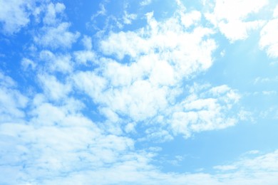 Photo of View of blue sky with white fluffy clouds