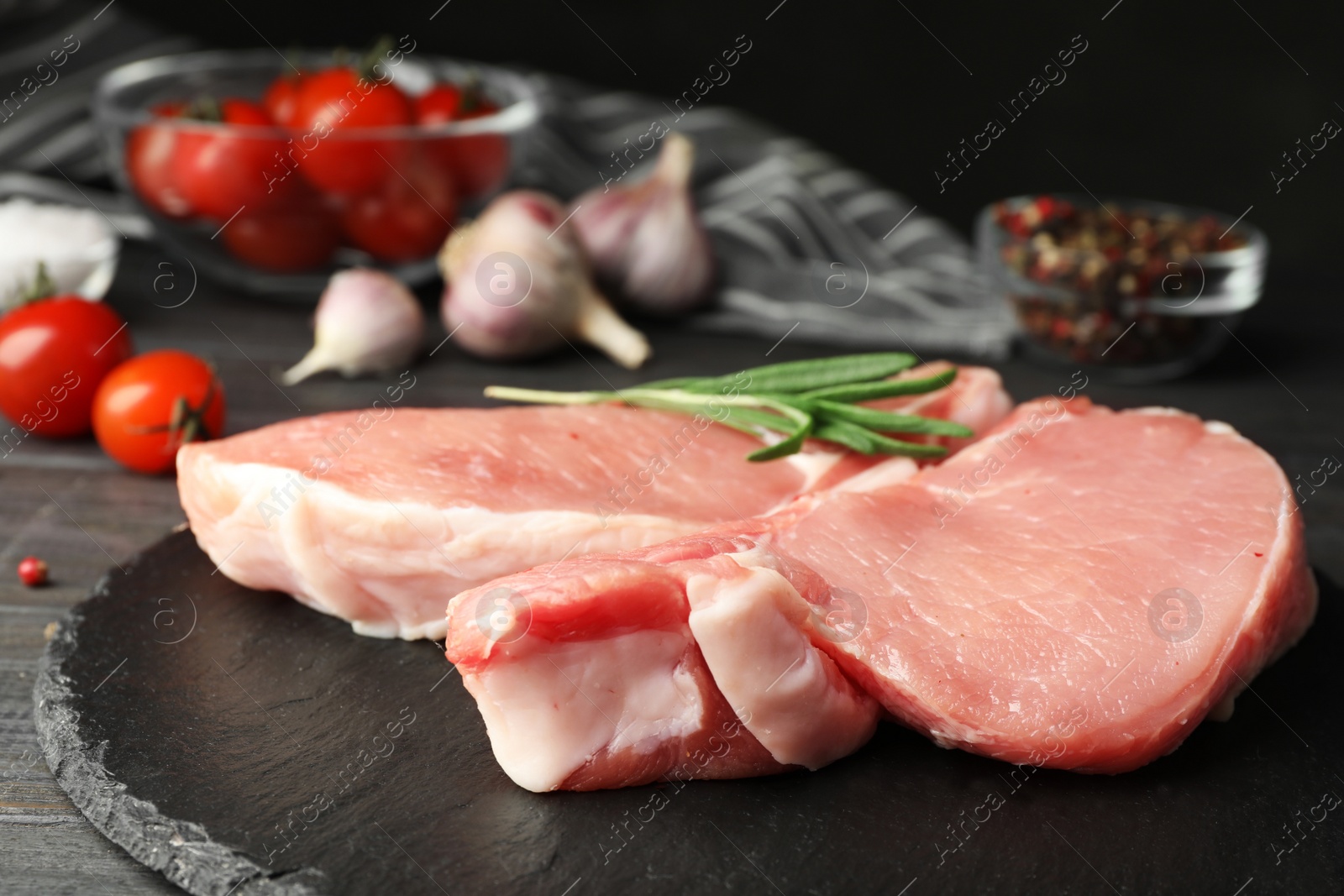 Photo of Fresh raw cut meat on slate plate