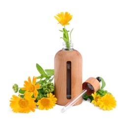 Photo of Bottle of essential oil and calendula flowers on white background