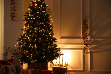 Beautiful living room interior with decorated Christmas tree and gifts