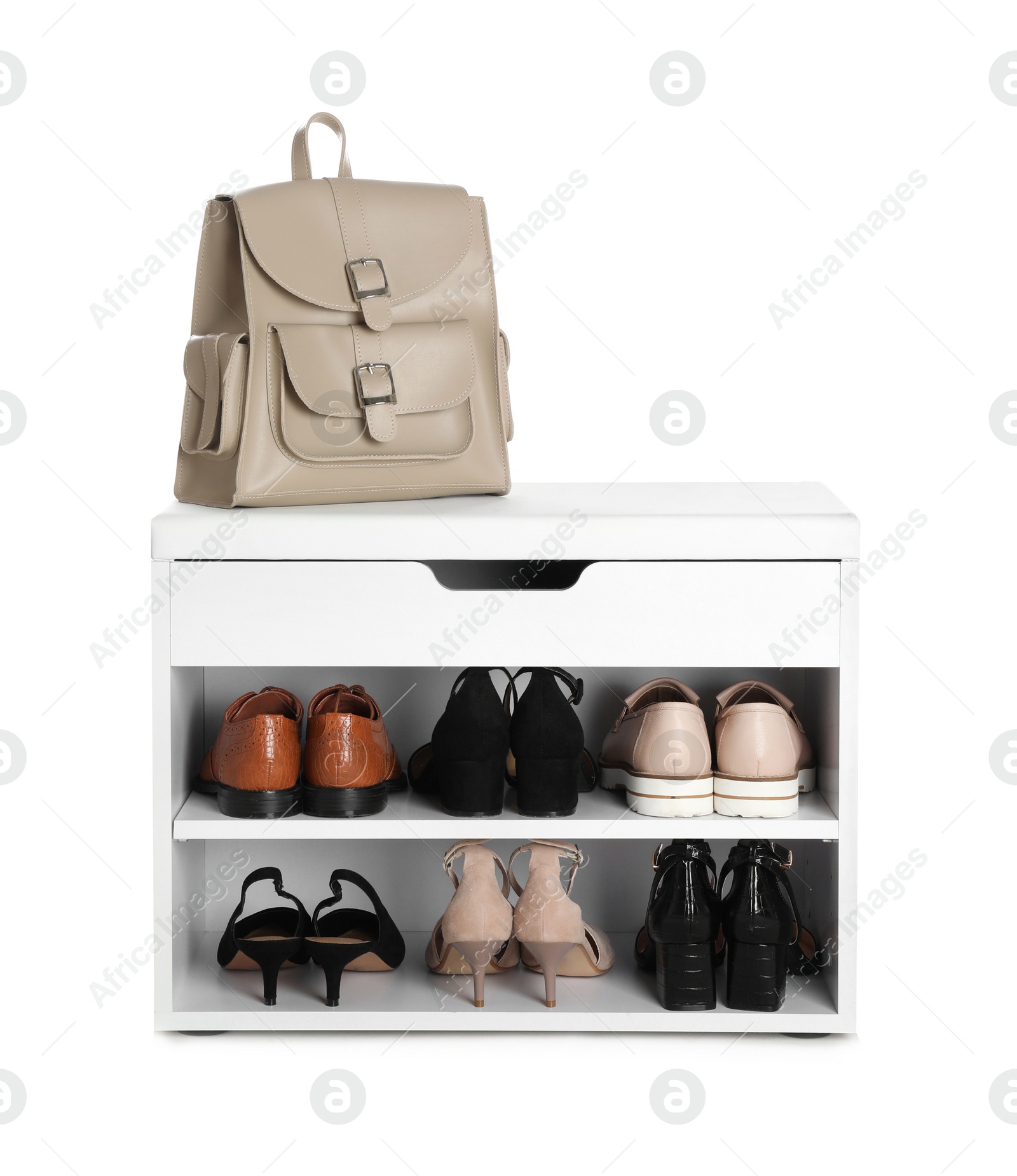 Photo of Stylish storage cabinet with different pairs of shoes and backpack on white background