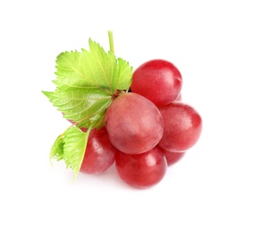 Photo of Bunch of red grapes with green leaves isolated on white