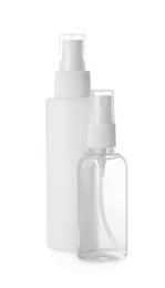 Spray bottles with antiseptic on white background