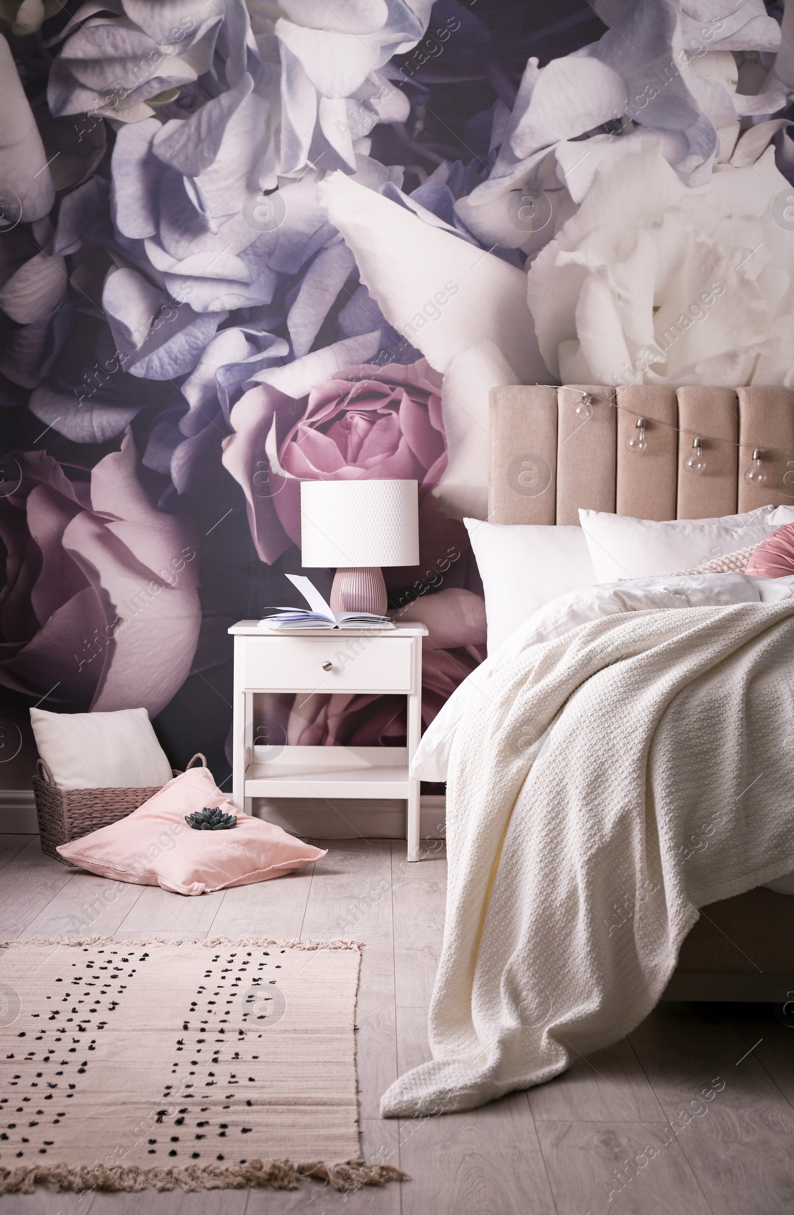 Photo of Stylish floral room interior with comfortable bed