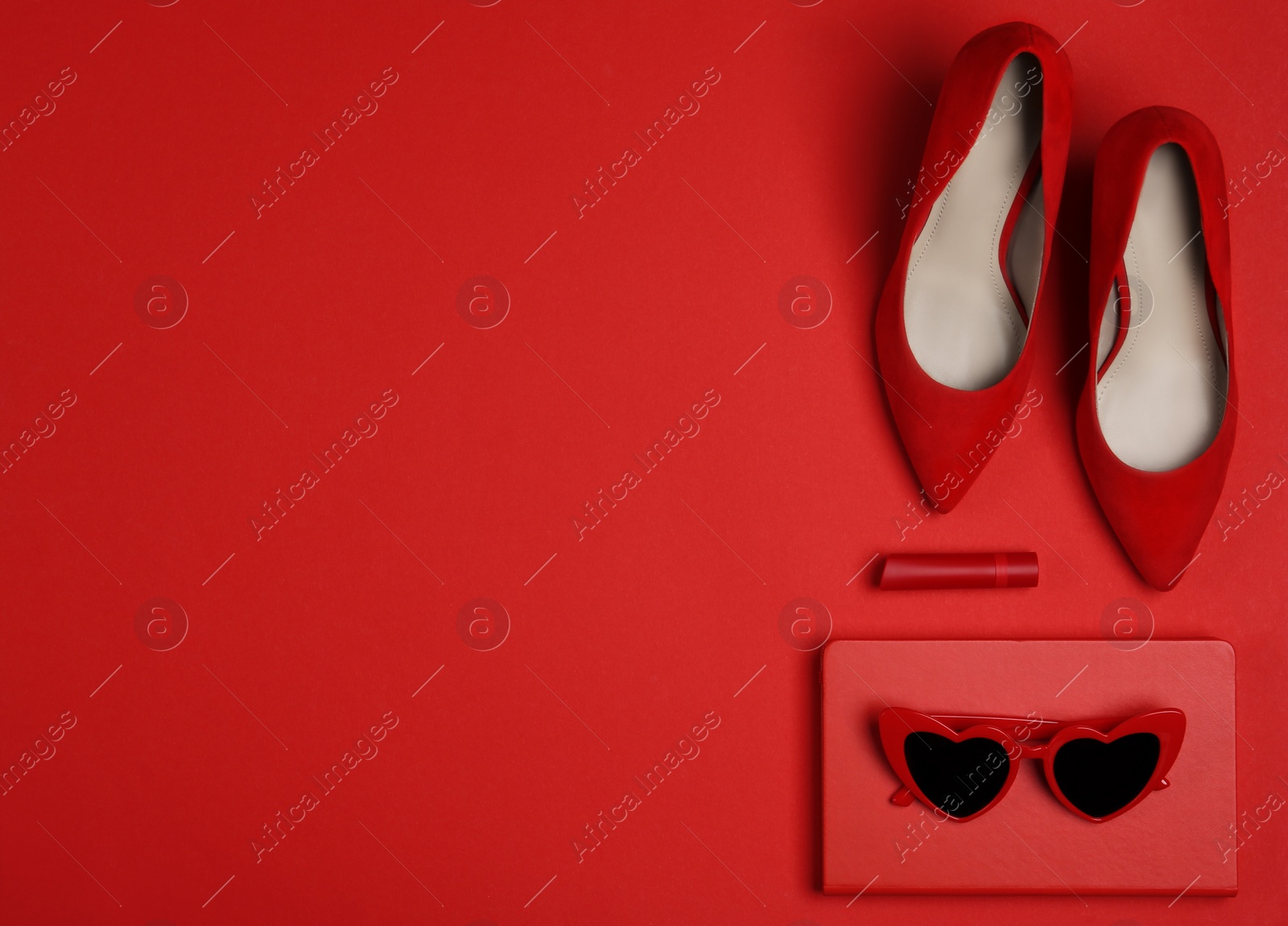 Photo of Flat lay composition with stylish women's shoes on red background. Space for text