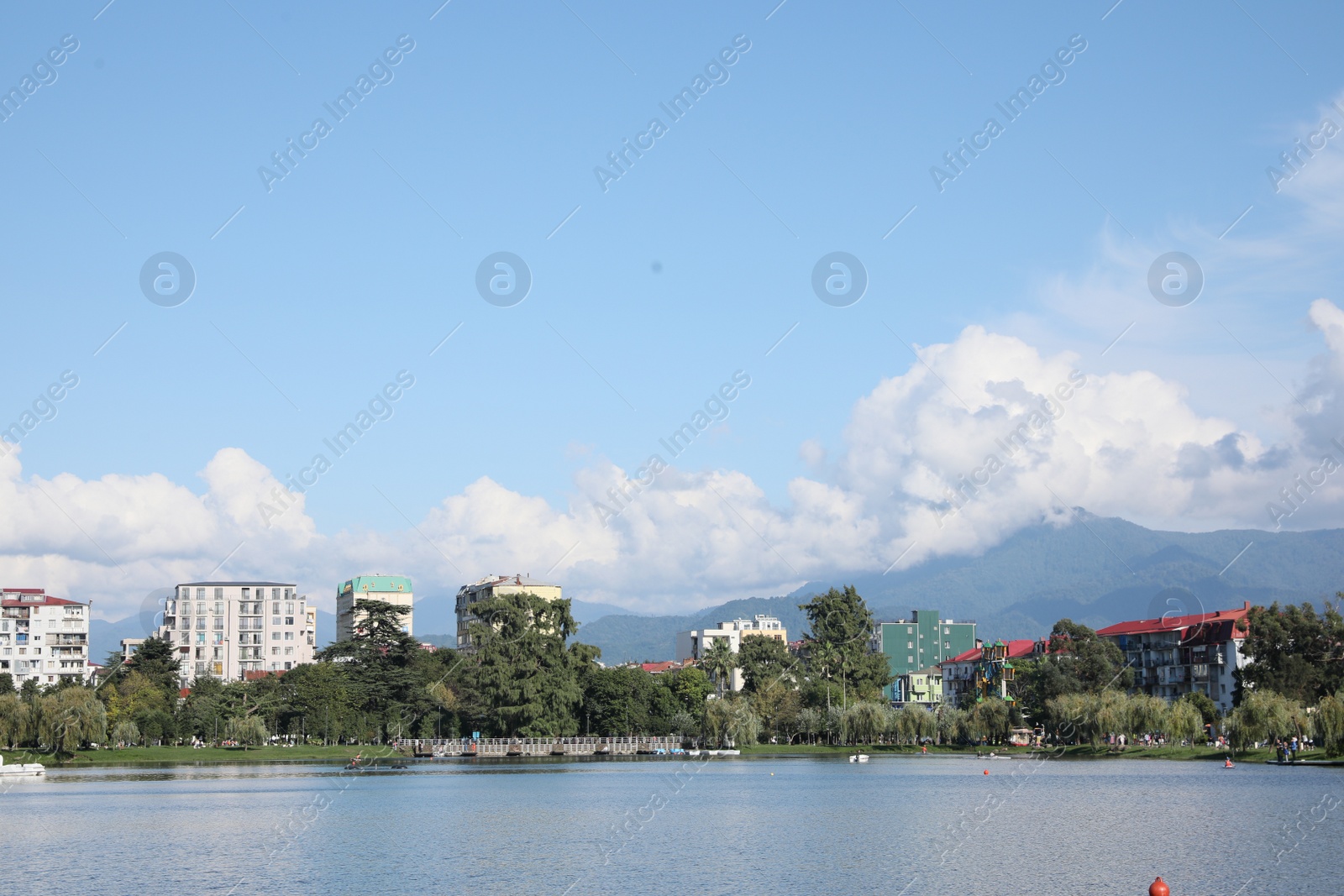 Photo of Batumi, Georgia - October 12, 2022: Picturesque view of city near Nurigeli lake and mountains