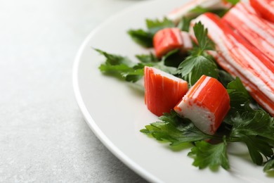 Crab sticks and parsley on light table, closeup