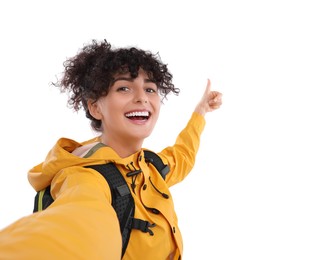 Beautiful woman taking selfie on white background