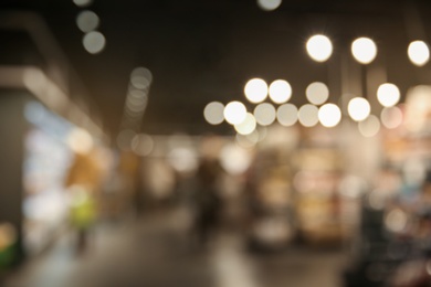 Photo of Blurred view of modern shopping mall interior