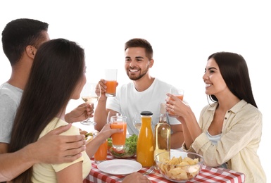 Group of friends at picnic table against white background