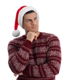 Photo of Thoughtful handsome man wearing Santa hat on white background