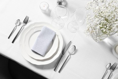 Photo of Beautiful table setting with floral decor, flat lay
