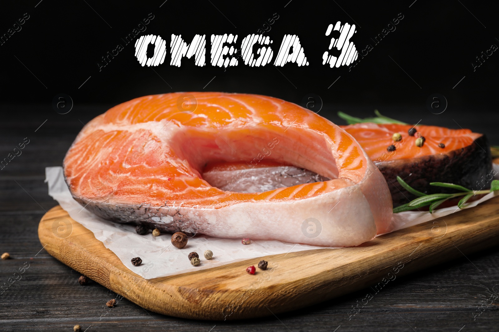 Image of Omega 3. Board with fresh salmon steaks and peppercorns on black wooden table, closeup