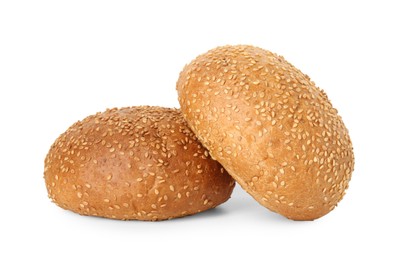 Two fresh hamburger buns with sesame seeds isolated on white