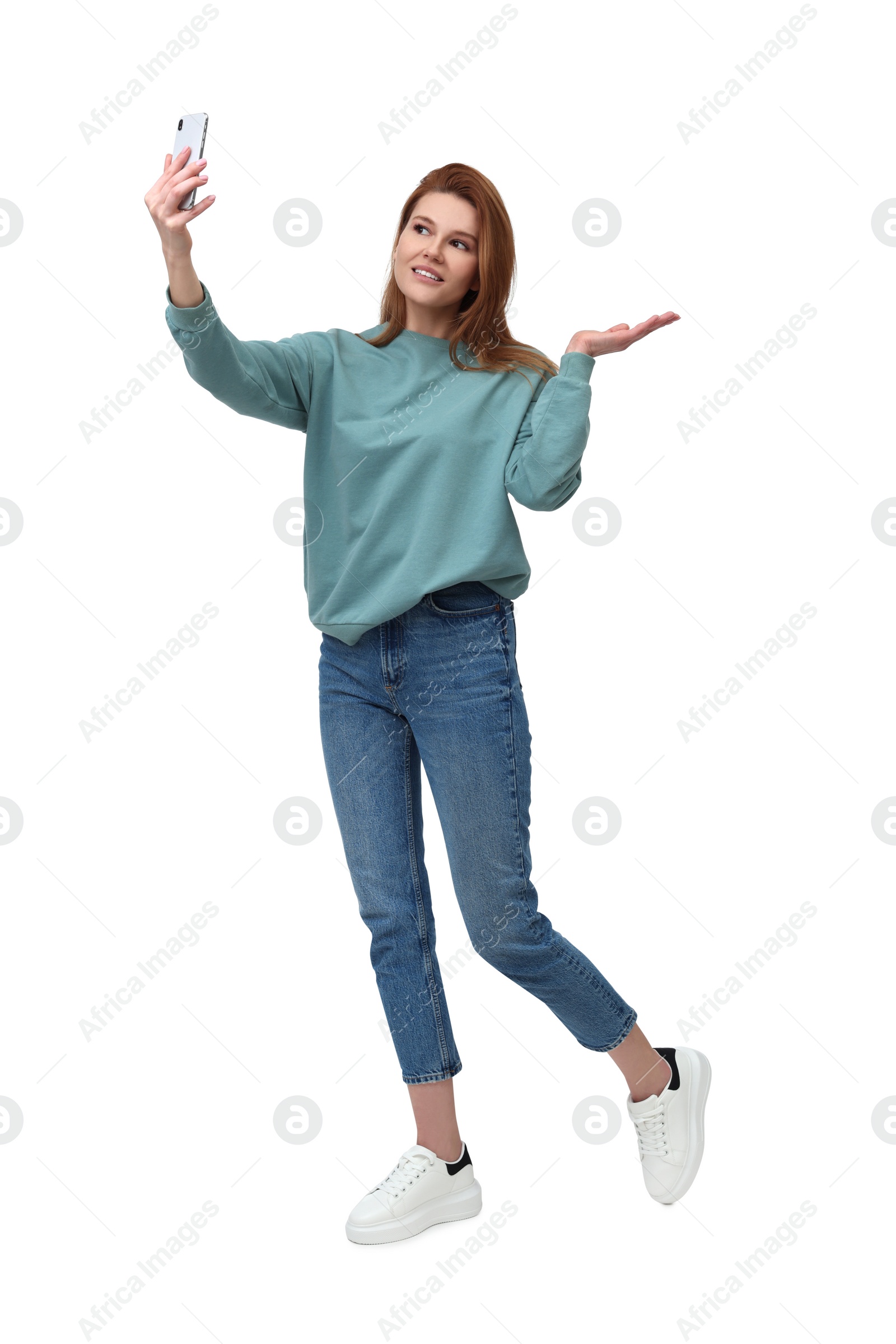 Photo of Beautiful woman taking selfie on white background