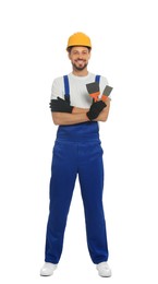 Photo of Professional worker with putty knives in hard hat on white background