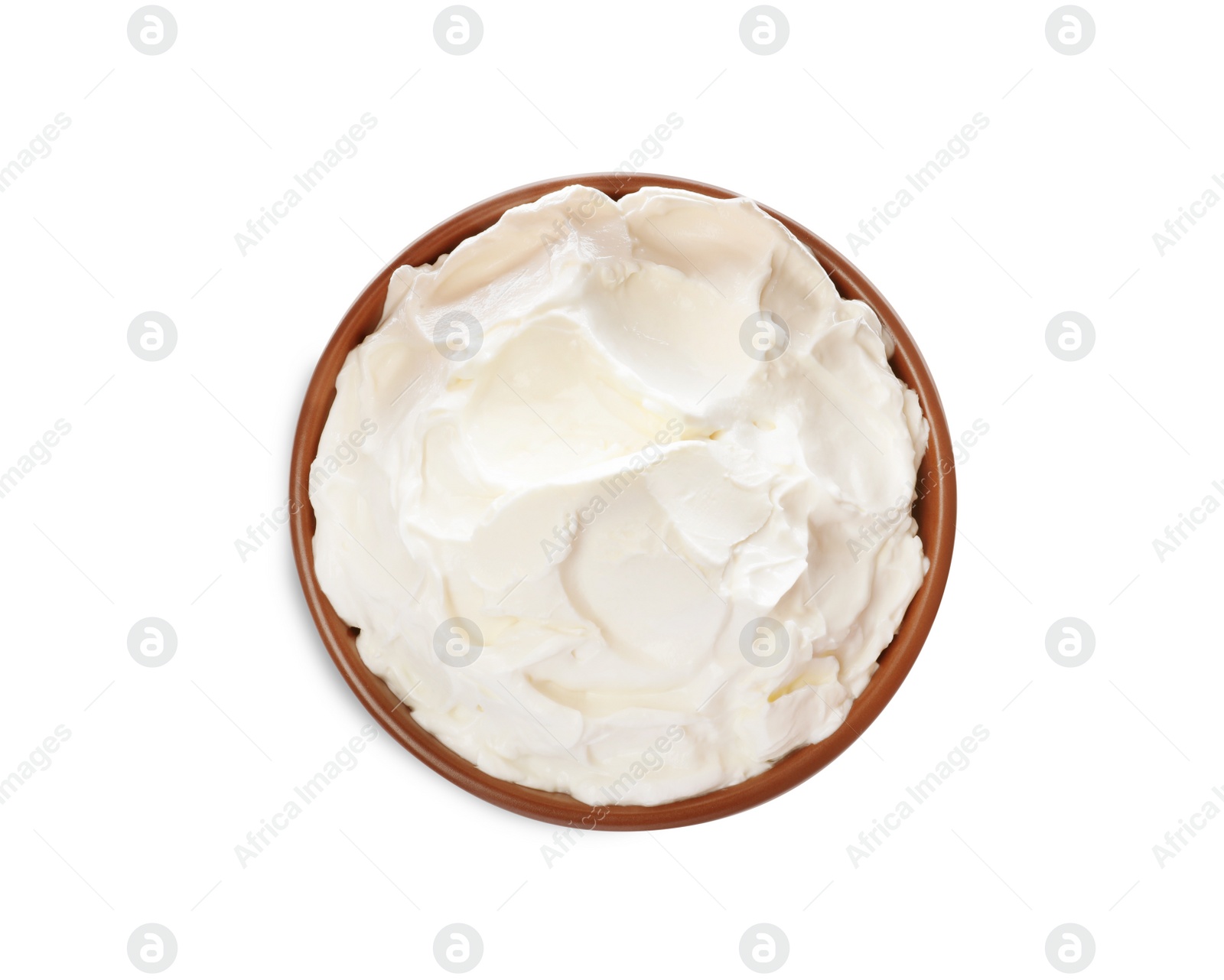 Photo of Bowl of tasty cream cheese isolated on white, top view