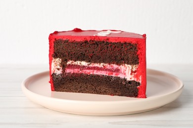 Photo of Cut bento cake on white wooden table, closeup. St. Valentine's day surprise