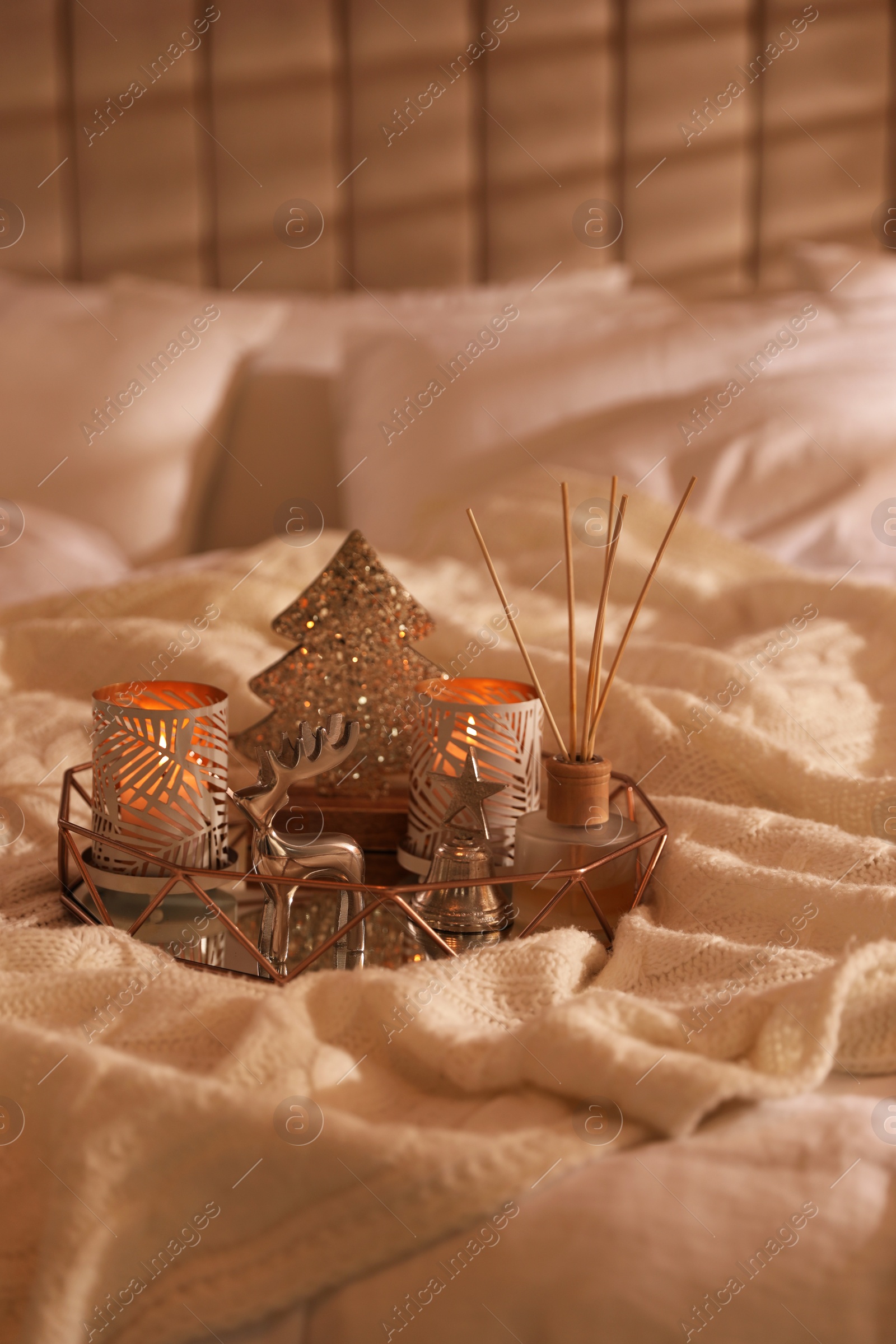 Photo of Composition with decorative Christmas tree and reindeer on blanket