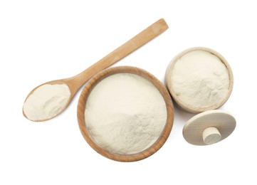 Photo of Wooden bowl, box and spoon of agar-agar powder on white background, top view