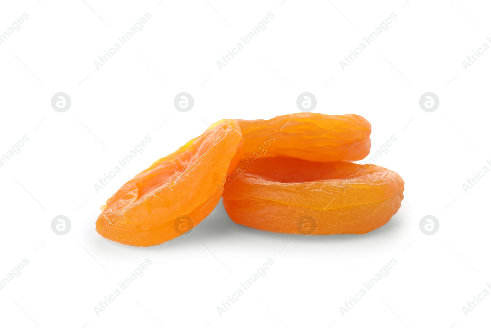 Photo of Tasty apricots on white background. Dried fruit as healthy food
