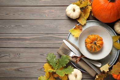 Photo of Festive table setting on wooden background, flat lay with space for text. Thanksgiving Day celebration