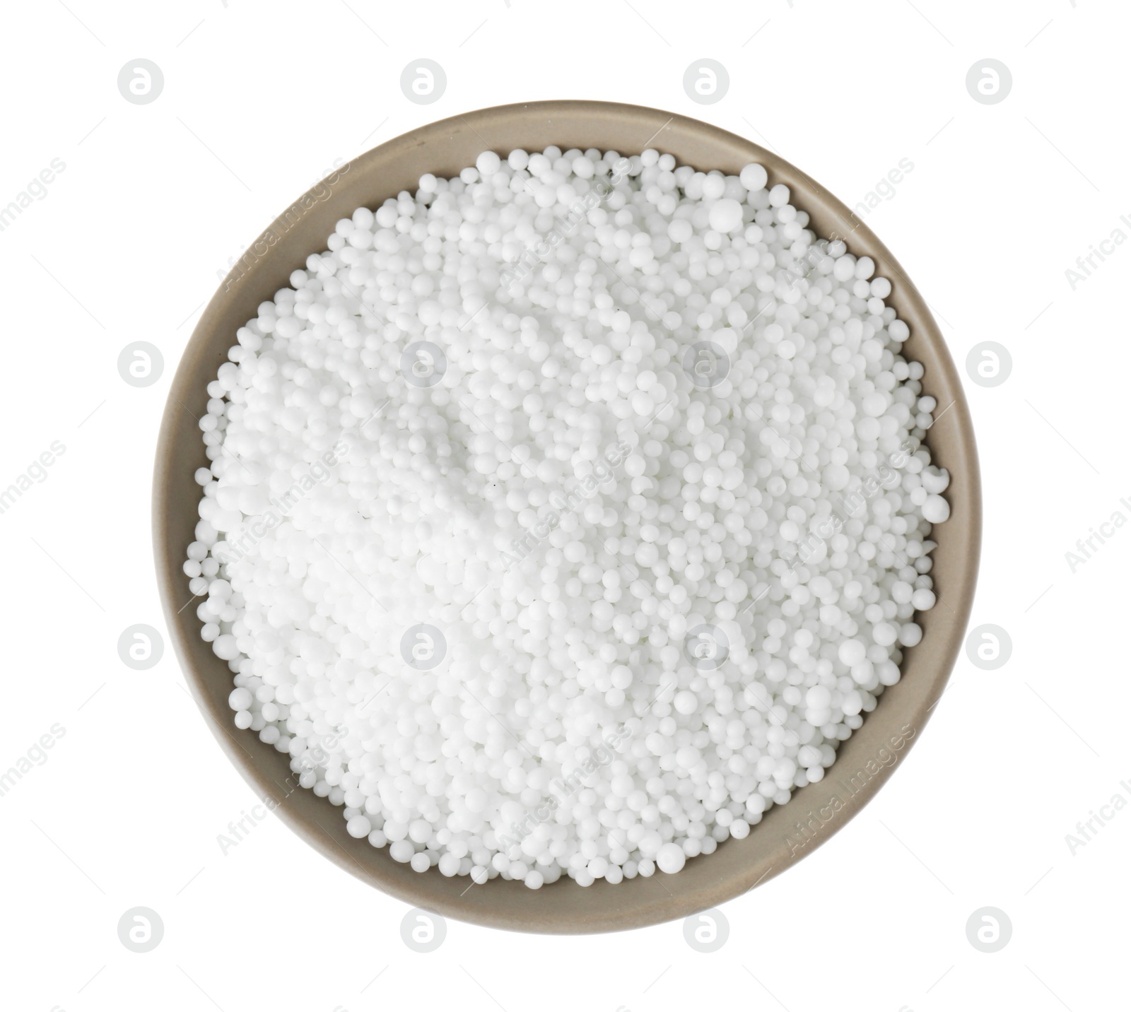 Photo of Pellets of ammonium nitrate in bowl isolated on white, top view. Mineral fertilizer