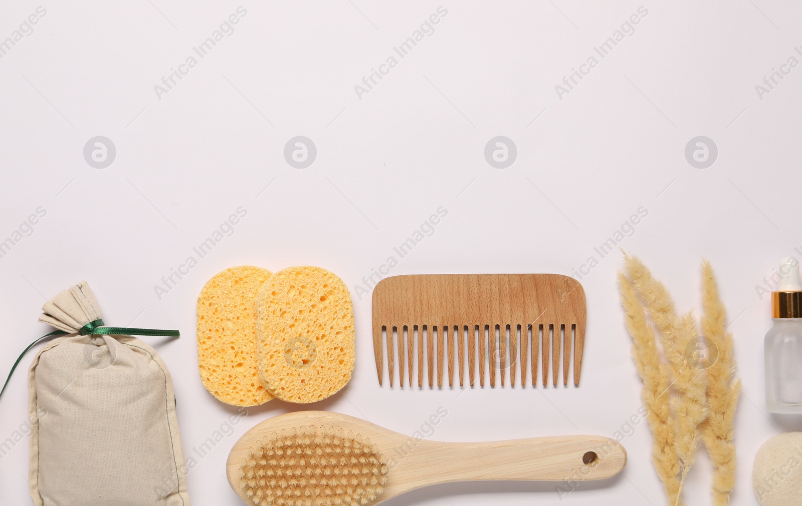 Photo of Bath accessories. Different personal care products and dry spikelets on white background, flat lay with space for text