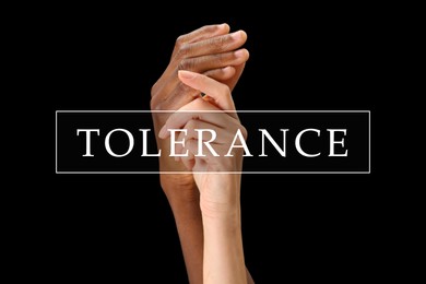 Tolerance, support and cooperation concept. Woman and man of different races holding hands on black background, closeup