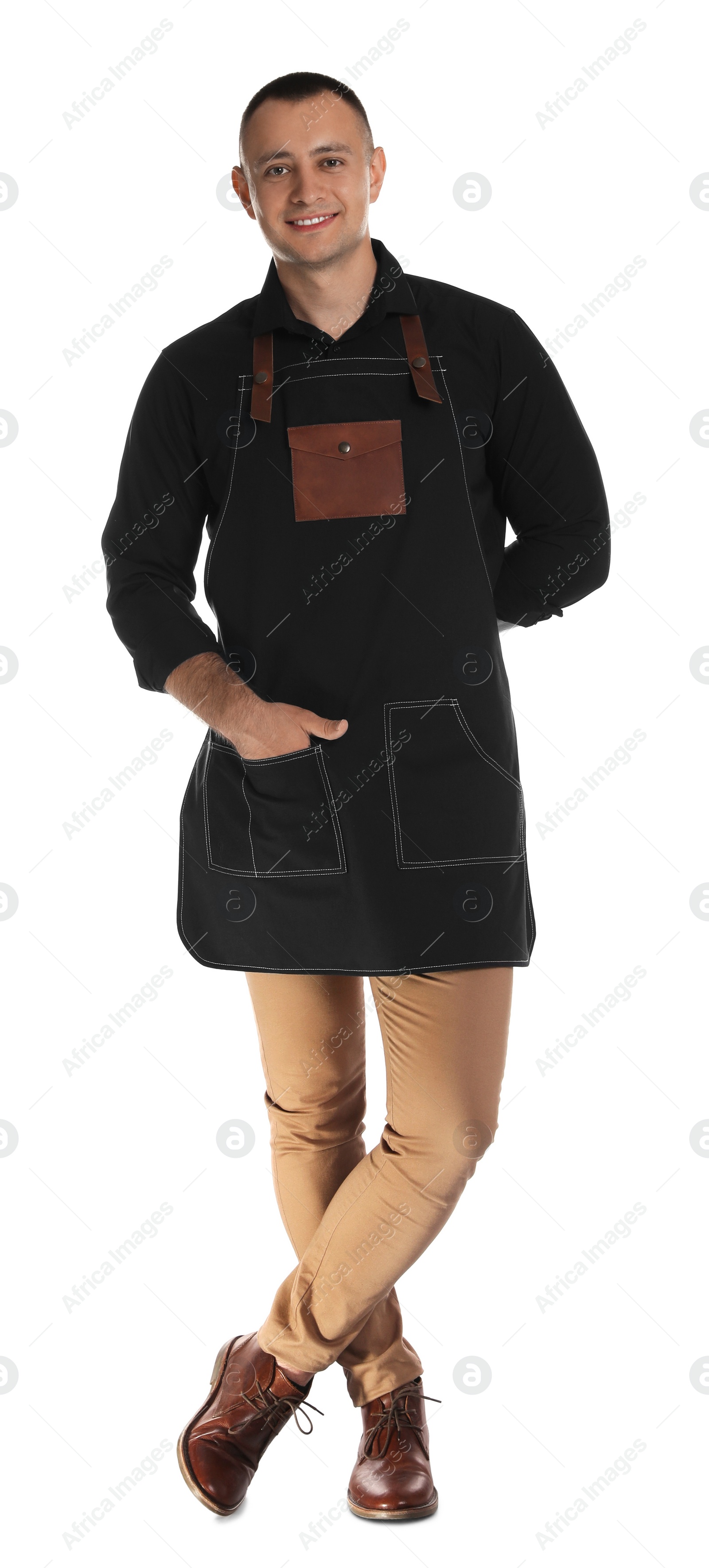 Photo of Full length portrait of happy young waiter in uniform on white background