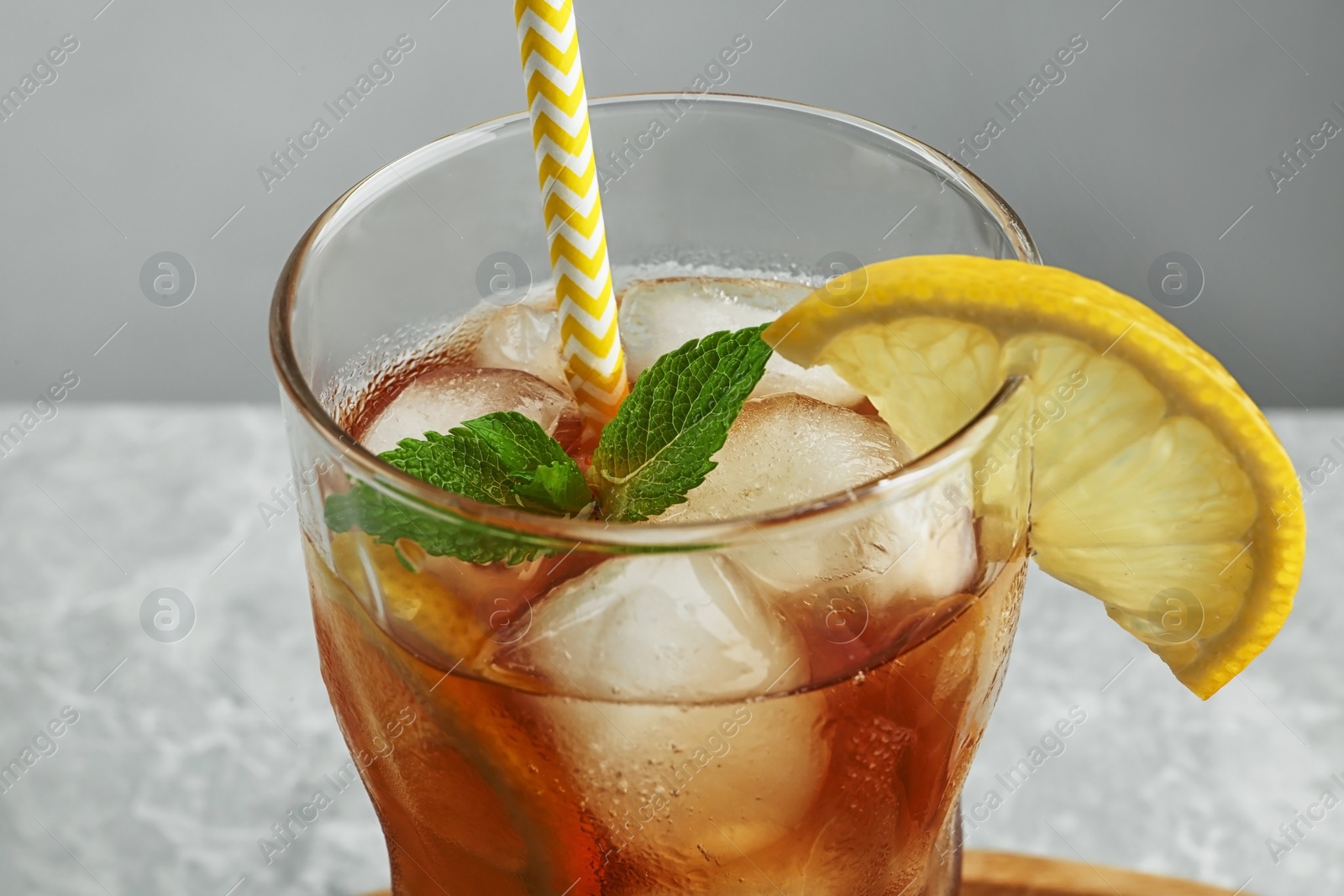 Photo of Glass of delicious iced tea, closeup view