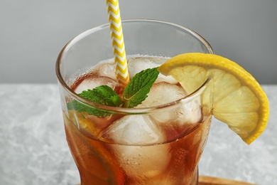 Glass of delicious iced tea, closeup view