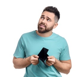 Confused man showing empty wallet on white background