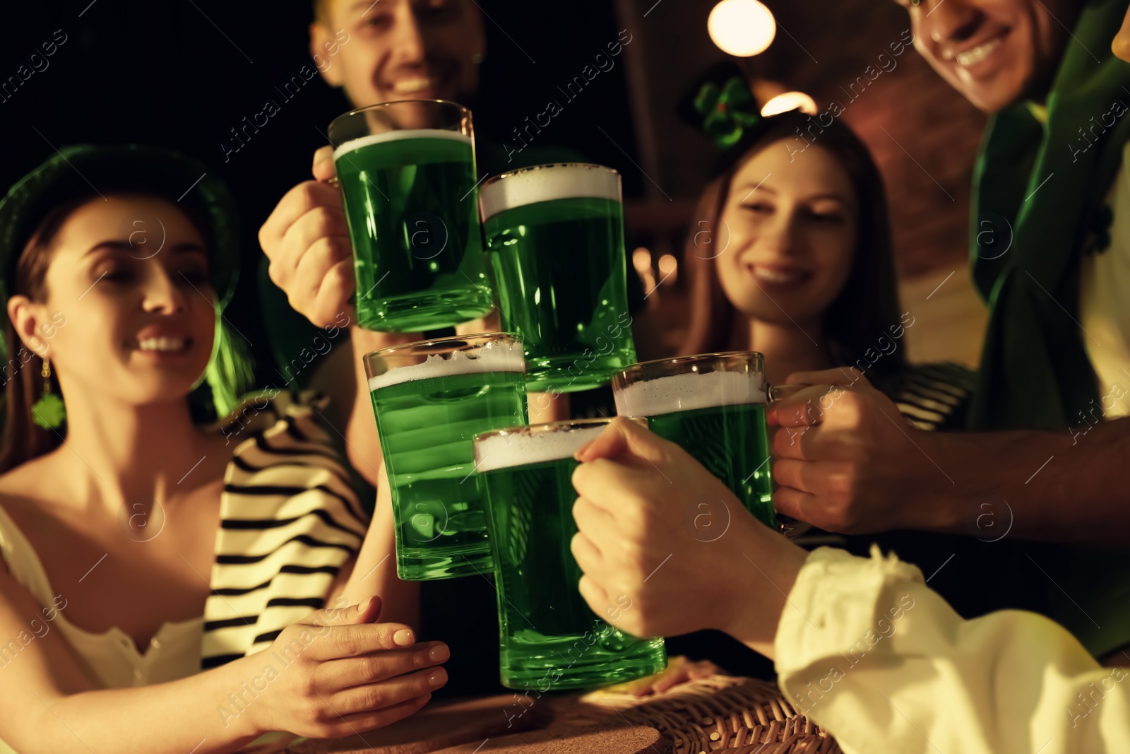 Photo of People with beer celebrating St Patrick's day in pub