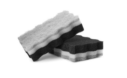 Photo of Layered cleaning sponges with abrasive scourers on white background