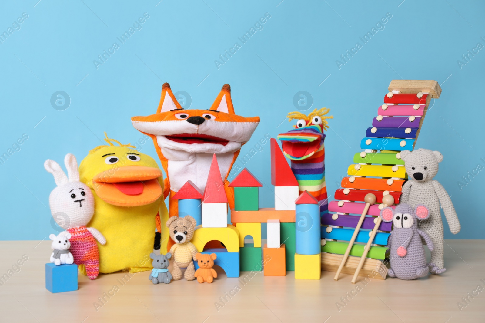 Photo of Collection of different toys on wooden table