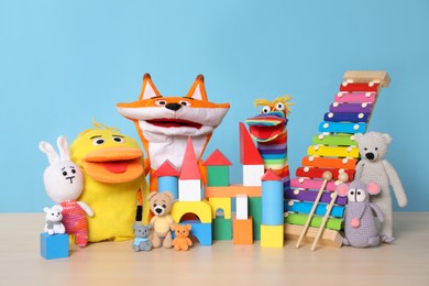 Collection of different toys on wooden table