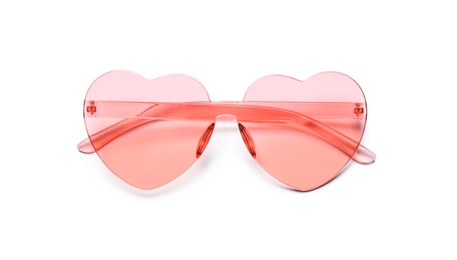 Stylish heart shaped glasses on white background