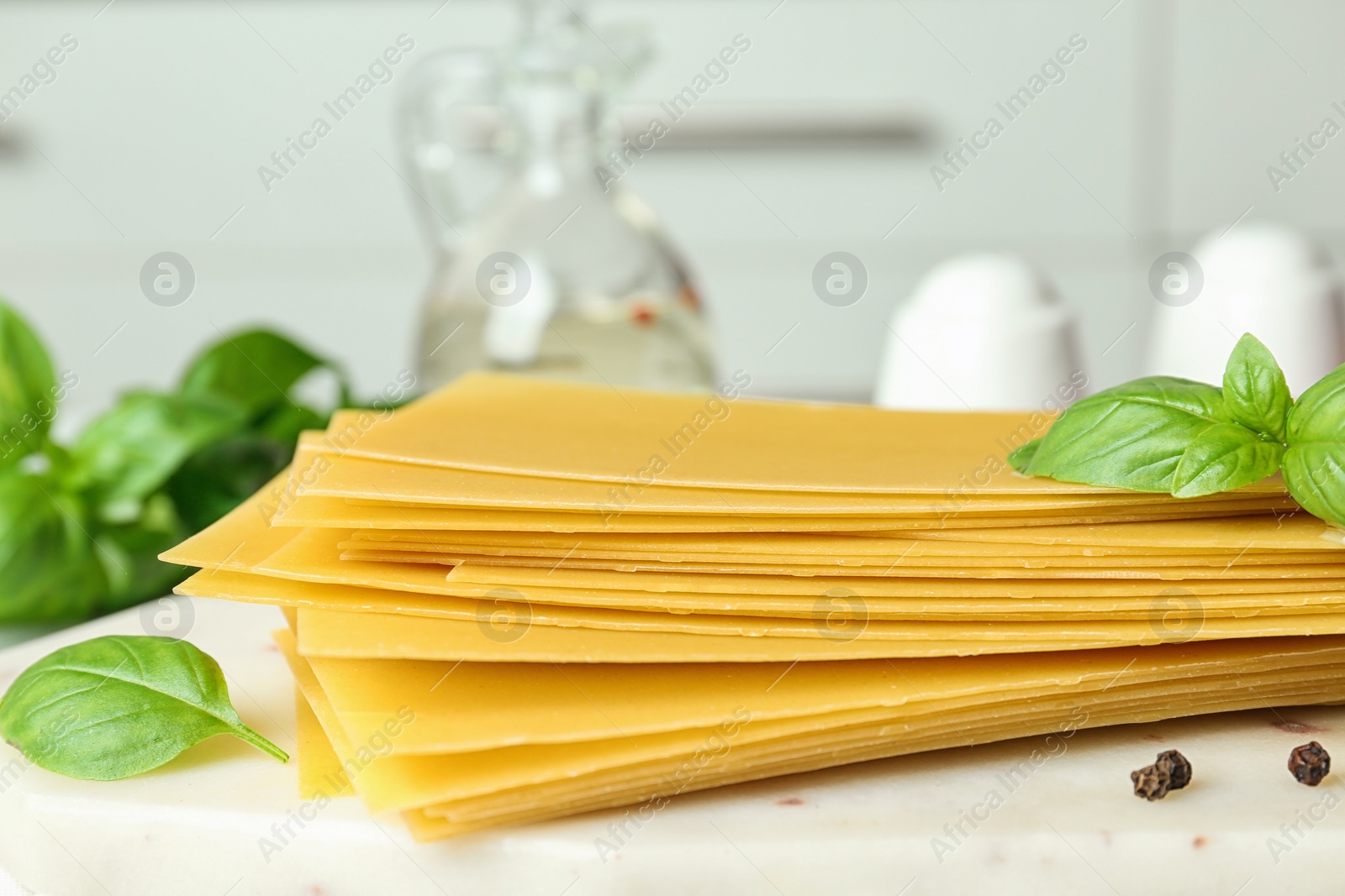 Photo of Composition with uncooked lasagna sheets on table, closeup