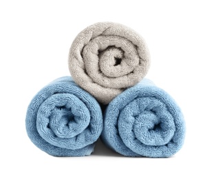 Photo of Rolled soft terry towels on white background